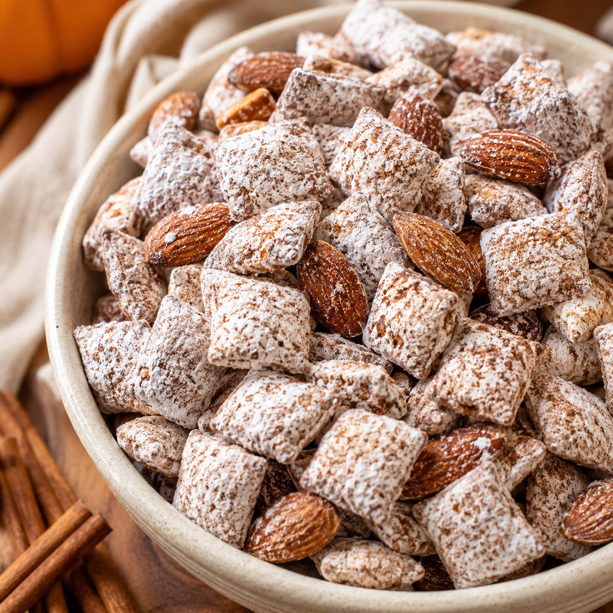 Pumpkin Spice Puppy Chow with powdered cereal squares and almonds