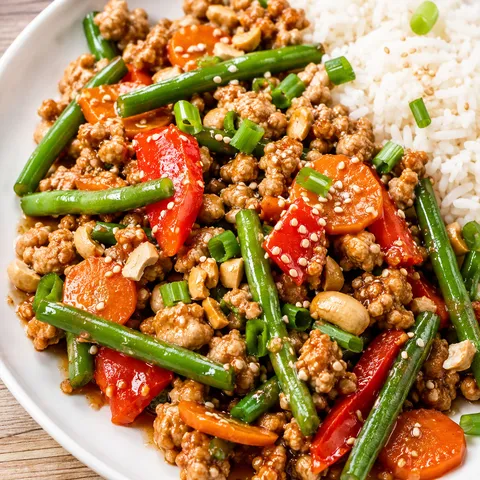 Sesame chicken and green bean stir fry with cashews and scallions