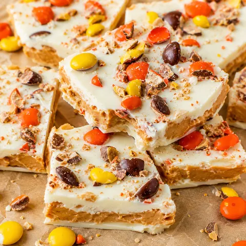 Reese's Pieces peanut butter white chocolate bark on parchment