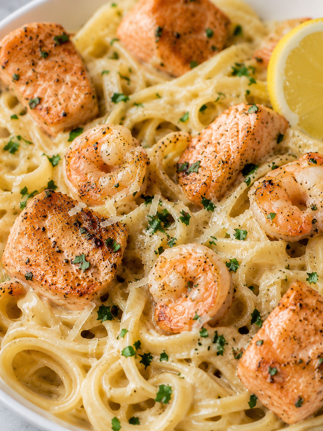 Salmon And Shrimp Alfredo, plated and served