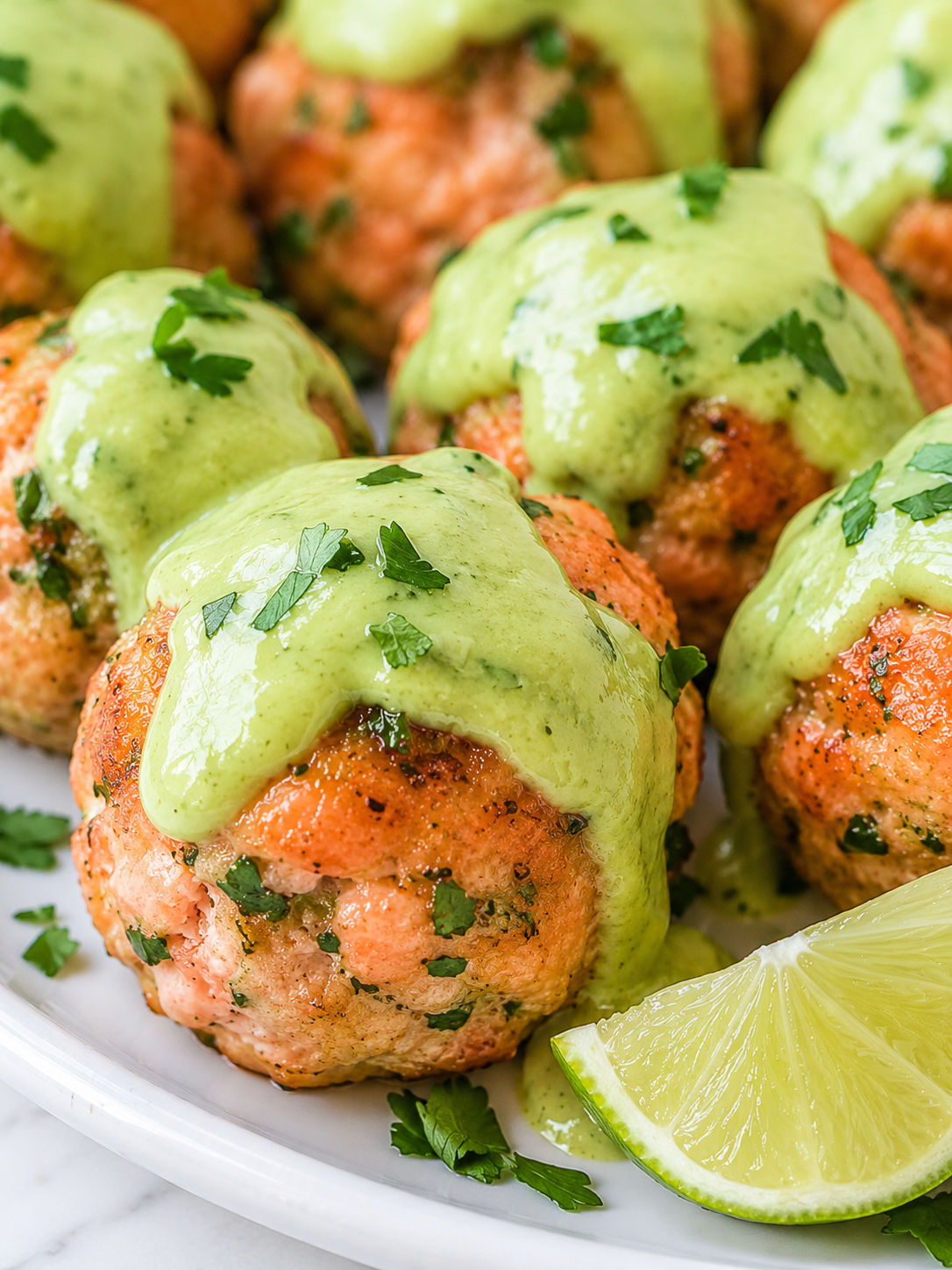 Salmon Meatballs with Creamy Avocado Sauce, plated and served