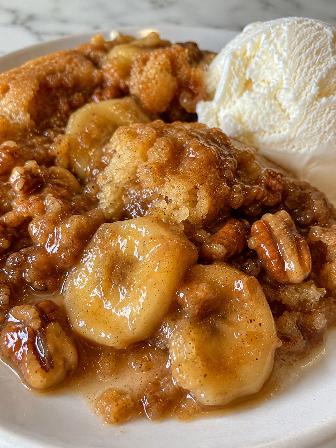 Savor The Unique Delightful Bananas Foster Cobbler Today, plated and served