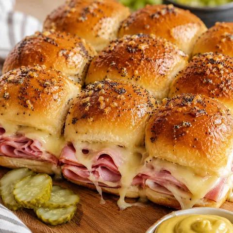 Ham and cheese Hawaiian roll sliders with golden poppy seed tops