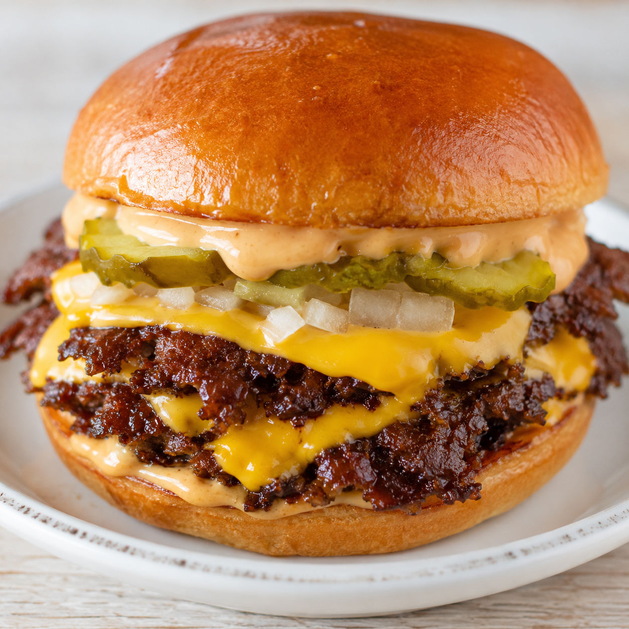 Double Smash Burger with melted cheese, pickles, onion, and sauce
