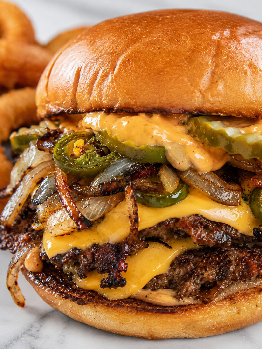 Spicy Jalapeño-Onion Smash Burgers, plated and served