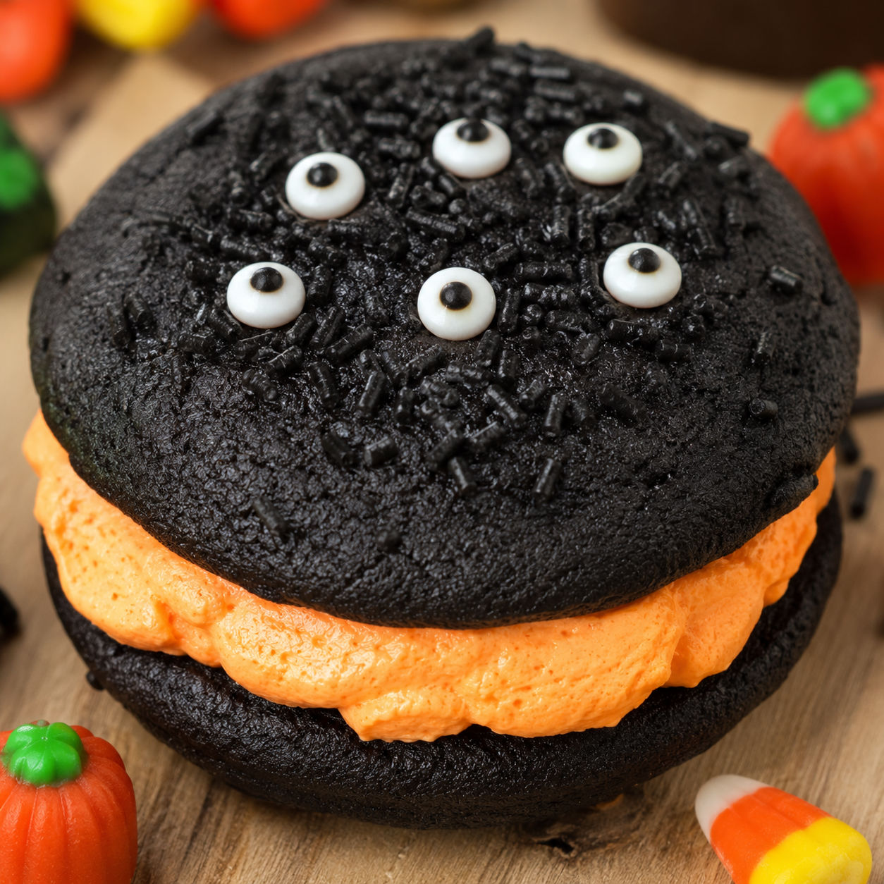 Spooky Halloween whoopie pie with black chocolate cakes and orange marshmallow filling
