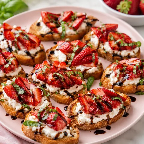 Strawberry goat cheese crostini with basil and balsamic glaze
