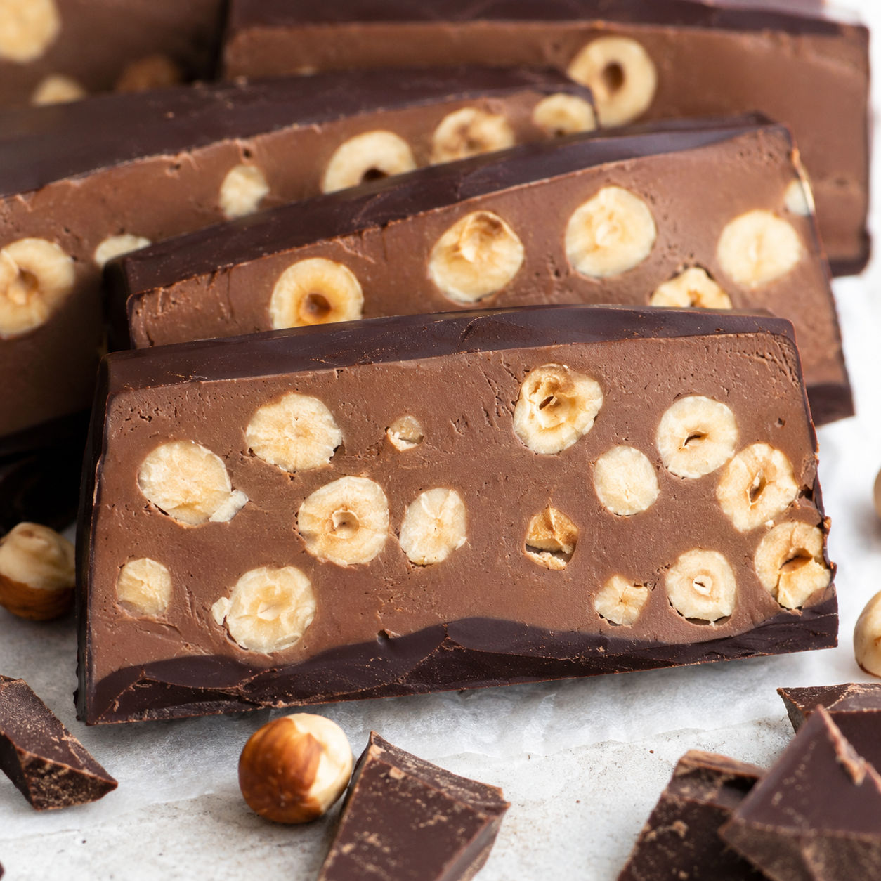 Triple chocolate hazelnut torrone slices with toasted hazelnuts