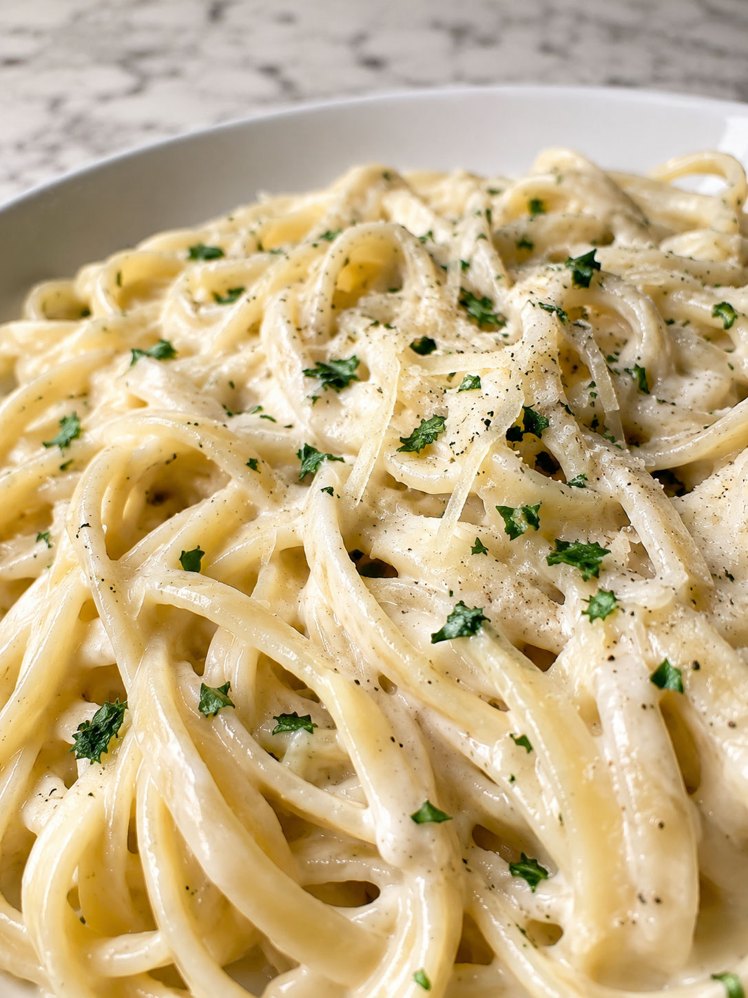 Ultimate Olive Garden Alfredo Pasta, plated and served
