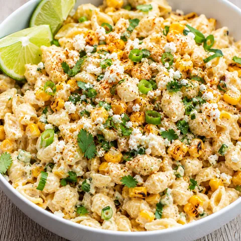 Mexican street corn pasta salad with cotija, cilantro, corn, and lime
