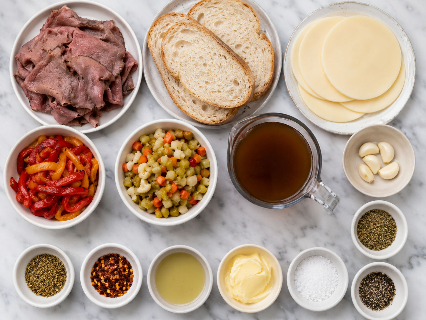 Ingredients for Chicago Italian beef grilled cheese on a wooden surface