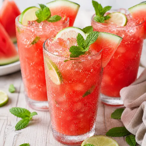 Watermelon lime mint mocktails with ice, lime wheels, and mint