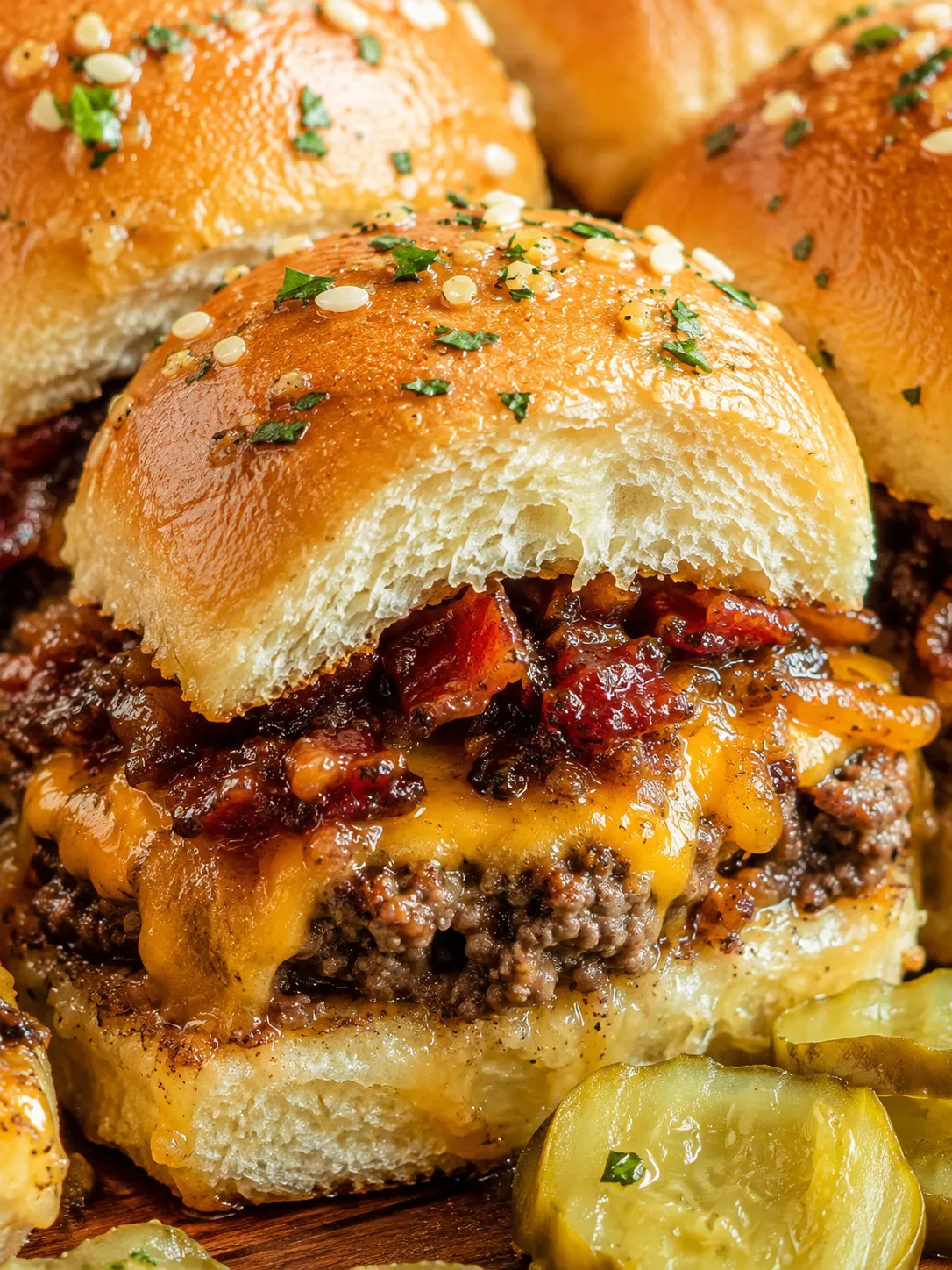Bacon jam cheeseburger sliders with melted cheddar and golden rolls