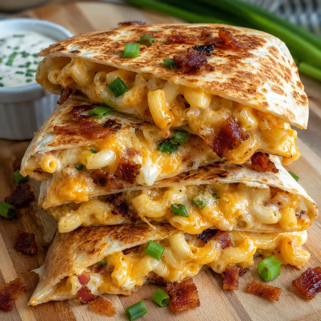 Bacon ranch mac and cheese quesadilla with melted cheese and green onions