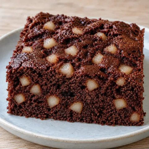 Chocolate sheet cake with cardamom and pear