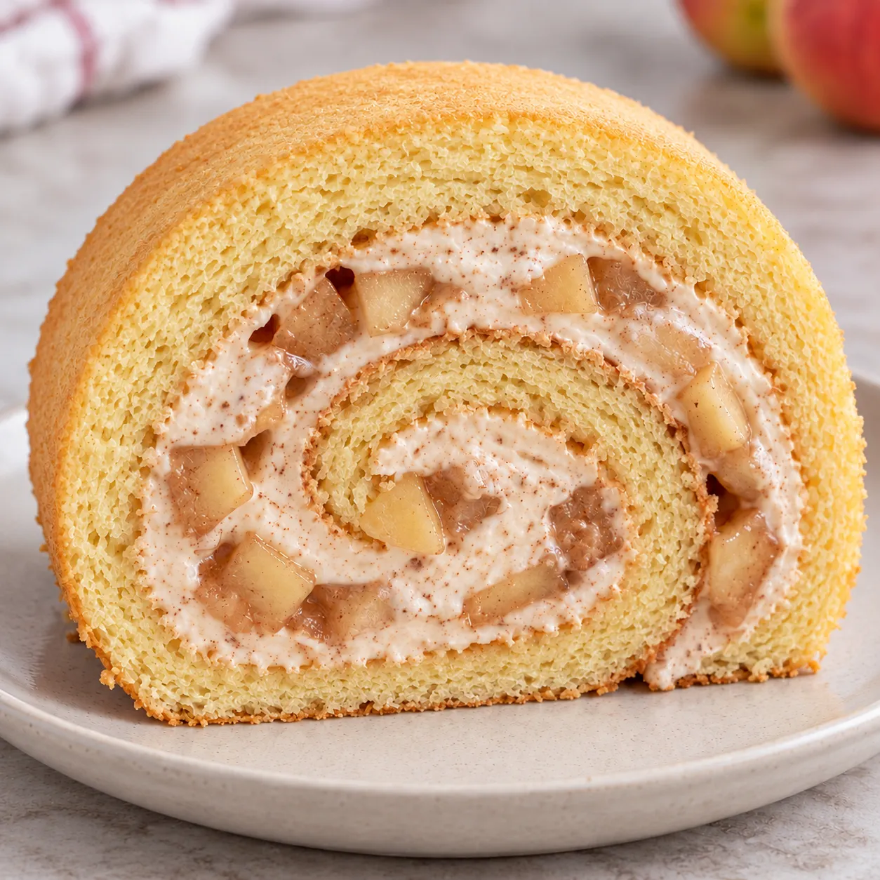 Sponge roll with cinnamon and apple