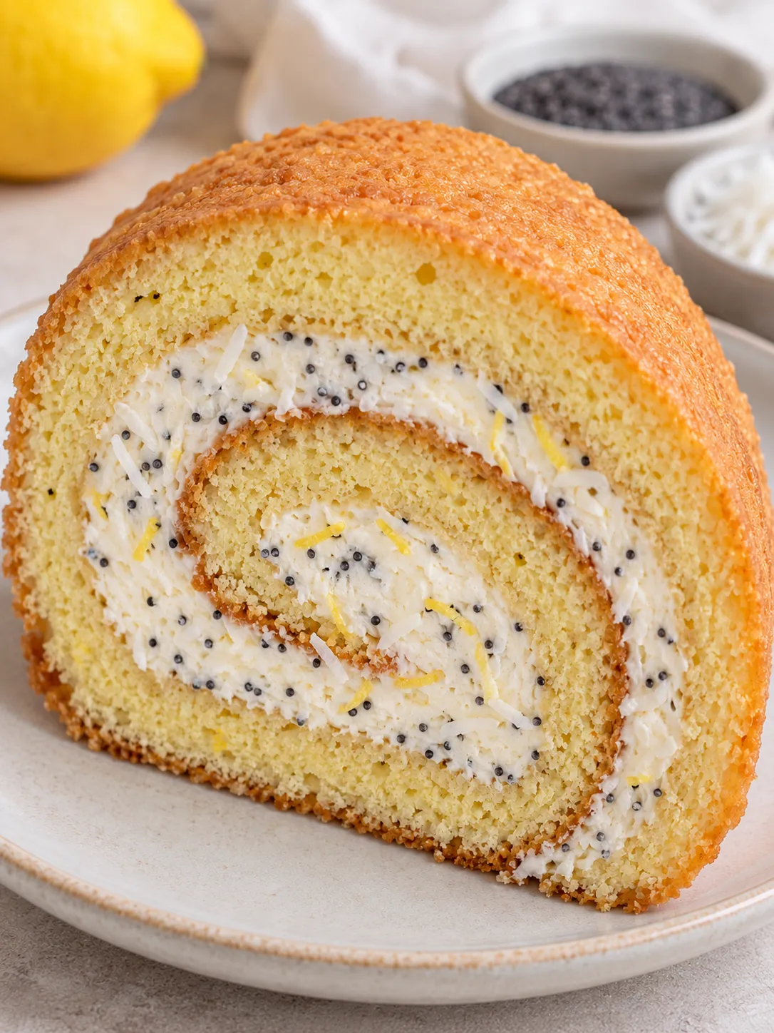 Sponge roll with lemon and poppy seeds — coconut