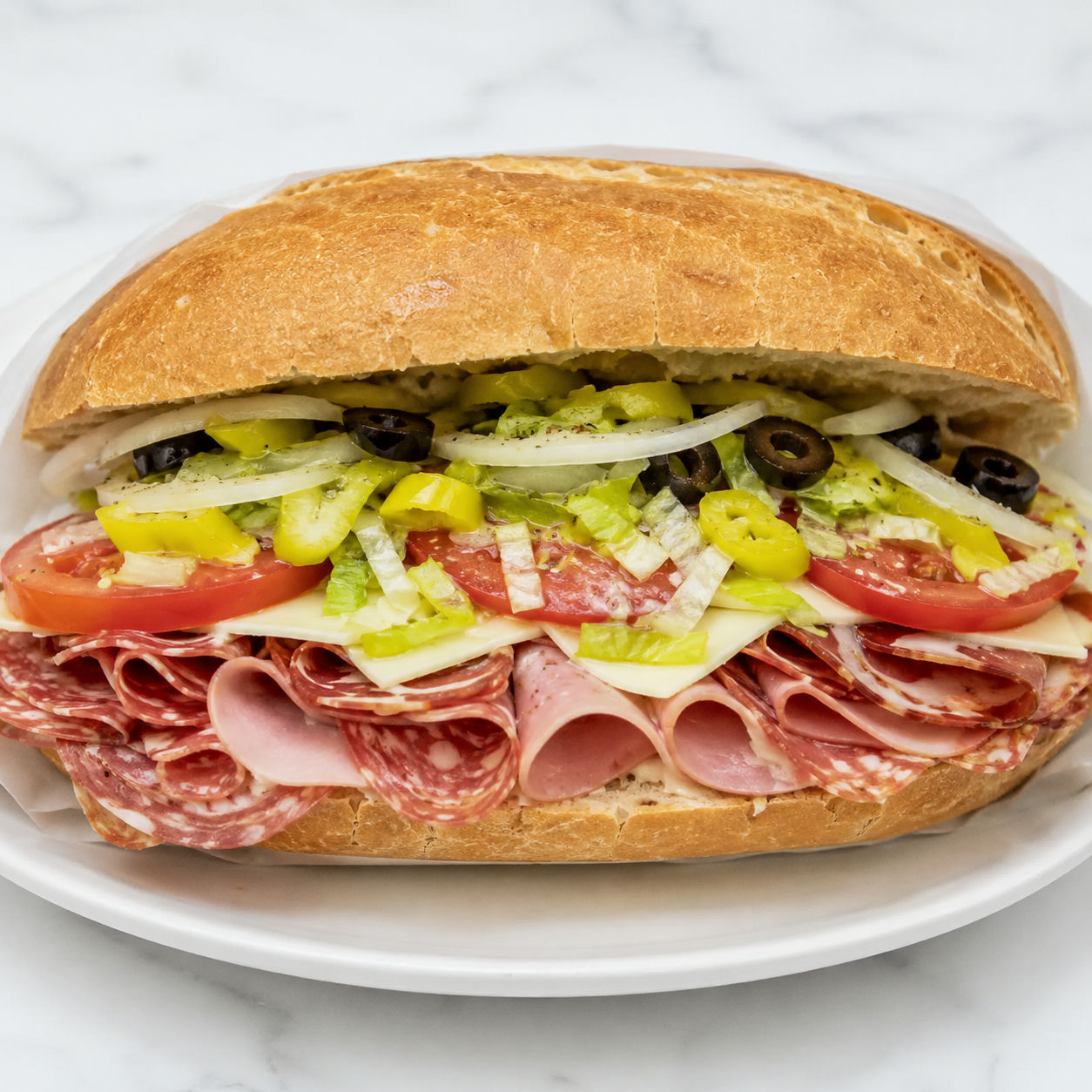 Loaded Italian hoagie with deli meats, provolone, lettuce, tomatoes, and peppers