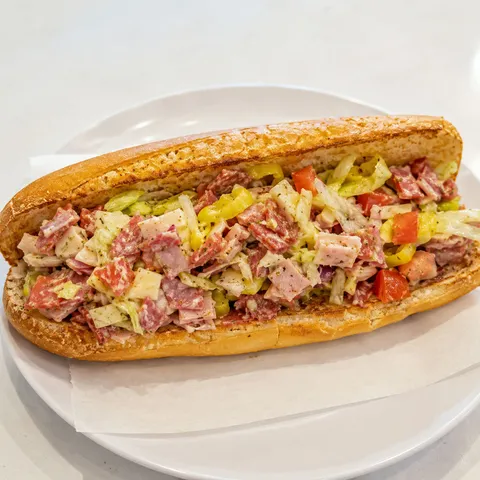 Chopped Italian deli sandwich with salami, provolone, lettuce, and pepperoncini