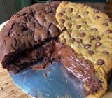 A chocolate cake with chocolate icing and chocolate chips.