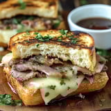 A close up of a delicious Texas Toast French Dip sandwich.