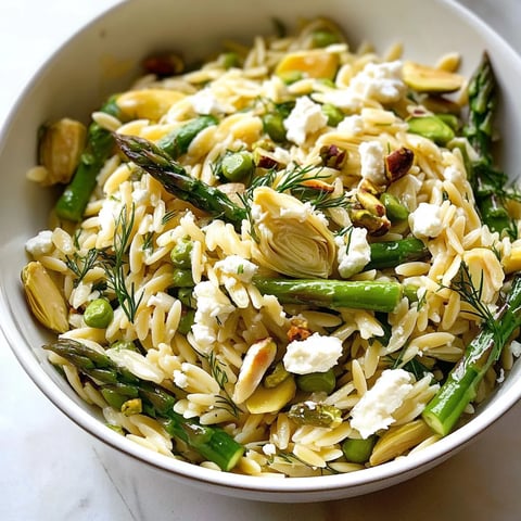 A bowl of rice with vegetables and feta cheese.