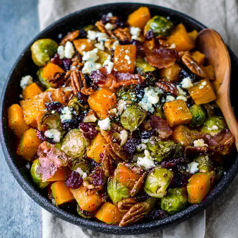 A bowl of Spicy Maple Roasted Butternut Squash & Brussels Sprouts with Crispy Bacon.