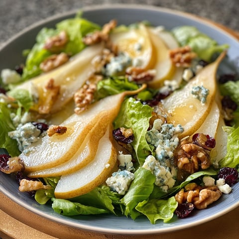 A Barefoot Contessa Pear and Blue Cheese Salad is displayed on a plate.